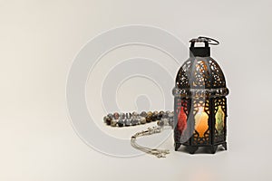 Colored Lantern with rosary beads.