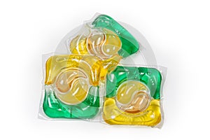 Colored laundry capsules on a white background