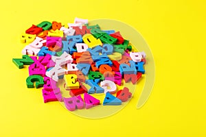 colored letters of the alphabet on a yellow background