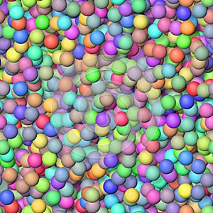 Colored little balls randomly scattered on the seamless background - top view