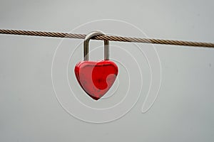 Colored locks hanging on the bridge for love