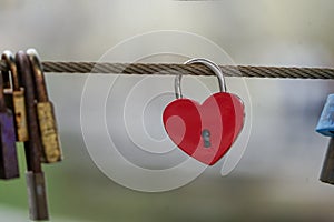 Colored locks hanging on the bridge for love