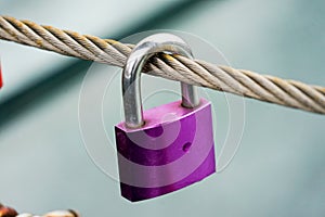 Colored locks hanging on the bridge for love