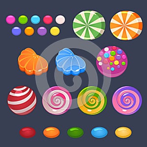Colored lollipops, jekky and candies set on dark background