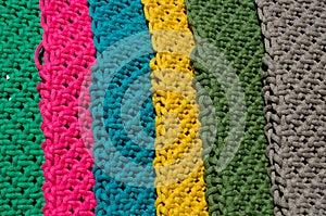 Colored macrame stripes in blue, yellow, red, beige, green and pink colors