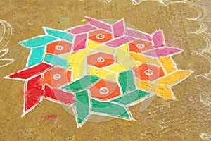 A colored mandala is painted on sand or on the ground. India, th