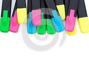 Colored markers isolated on white background close up