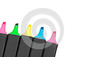 Colored markers isolated on white background. Close up.