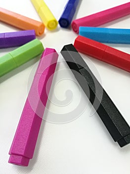 Colored markers pen and sleeve spread isolated on white paper background, Set of multicolored color pen which selected focus fore