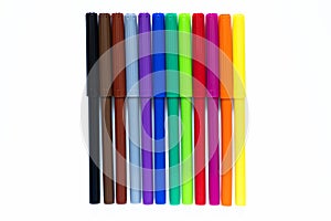 Colored markers on a white isolated background