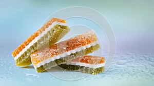 Colored marmalade in sugar. Fruit jelly on an abstract background. Gummy candy. Fruit sweets