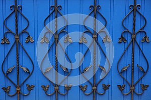 Colored metal texture of black wrought iron bars in a pattern