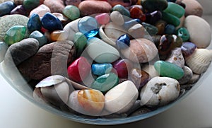 Colored Minerals And Smooth Sea Stones In A Transparent Vase