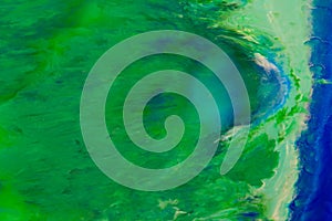 Green, turquoise and blue color marble mixed ink abstraction. photo