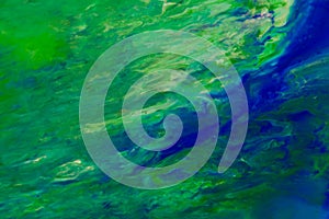 Green, turquoise and blue color marble mixed ink abstraction. photo