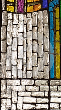 Colored mosaic stained glass window made of glass pieces. Textured window surface, backdrop texture.Texture backdrop decoration