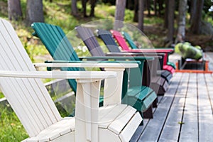 Colored Muskoka chairs on the dock