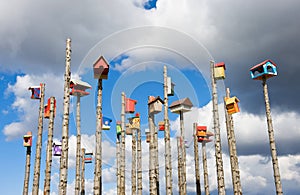 Colored nesting boxes on sky background, Iceland