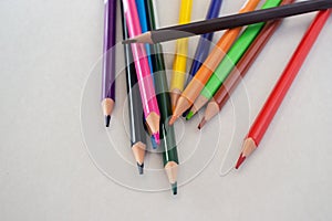 Colored new pencils on a white background.