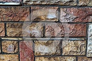 Colored old bricks of varying size texture photo close up