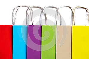 Colored paper bags on a white background