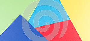 Color papers geometry flat composition background with yellow, green, red and blue tones