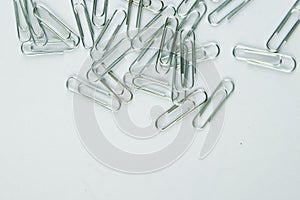 Colored Paper Clip among ordinary clips, which implies either it being a leader or a black sheep in group