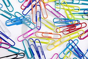 Colored paper clips on white background, Close-up