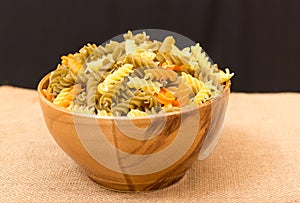 Colored pasta in a ceramical plate