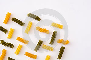 Colored pasta pattern on white background