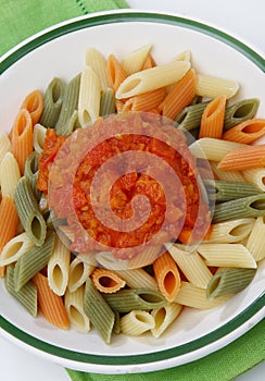 Colored pasta with tomato sauce