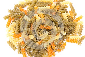 Colored pasta on white background