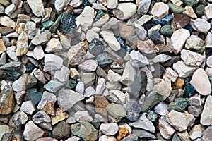 Colored pebbles texture background, decorative small stones texture