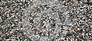 Colored pebbles texture background, decorative small stones texture