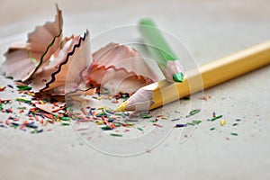 Colored pencil shavings in a white background