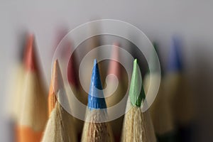 Colored pencil tips, with blurred background