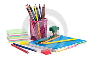 colored pencils in the basket, Eraser and pencil sharpener on white background