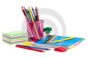 colored pencils in the basket, Eraser and pencil sharpener on white background