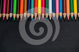 Colored pencils with black chalkboard space for messaging