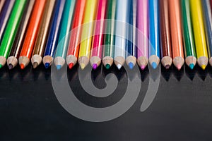 Colored pencils on blackboard