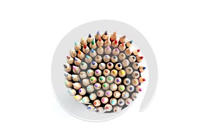 Colored pencils circle on white background from above