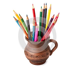 Colored pencils in a clay jug