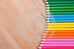 Colored pencils colored pencils on the wooden table clous-up