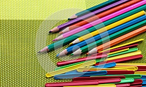 Colored pencils and counting sticks on a bright background