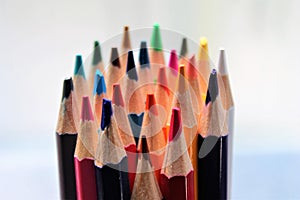 Colored pencils crayons close up sharpened rainbow many choice