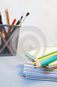 Colored pencils and a drawing pad. The concept of school children`s creativity