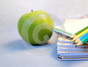 Colored pencils and a drawing pad. The concept of school children`s creativity