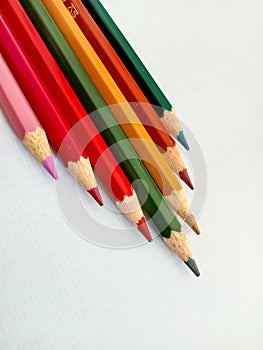 Colored pencils that have been sharpened are ready to be used for coloring