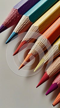 Colored Pencils Lined Up in a Row, Organized Array of Vibrant Drawing Tools