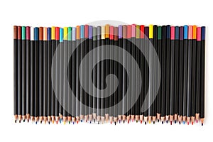 Colored pencils lined up on white background.
